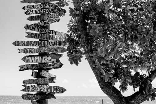 Key West Black and White Photography of A Key West Mileage Signpost to Other Cities A Key West Mileage Signpost to Other Cities -- Key West Black and White Photography