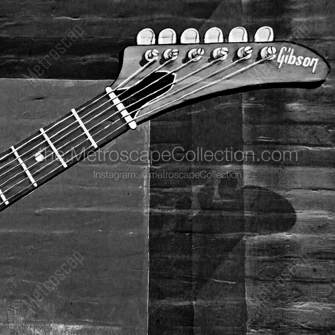 A Wall Mural of a Memphis Made Gibson Guitar night time black and white Photography square crop