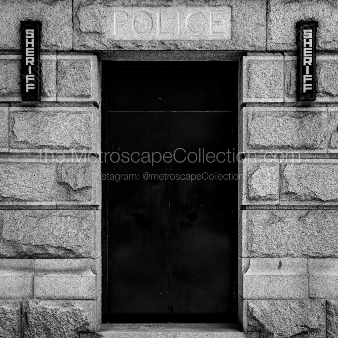A Police Door on the Vancouver Art Museum night time black and white Photography square crop