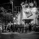 Square Crowds Mingle Outside of Esthers on Sixth black and white Pictures