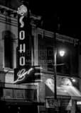 Vertical The Soho Lounge Sign on Sixth Street black and white Photography