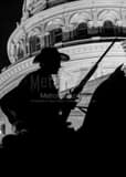 Vertical A Texas Ranger Silhouetted Against the Texas Statehouse Photography