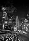 Vertical A Full Moon Rises Behind the Clouds over the Magnificent Mile landscape black and white Photography