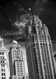 Vertical The Wind Whipping the US Flag on Top of the Tribune Building landscape black and white Photography