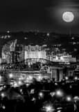 Vertical A Nearly Full Moon over Downtown Covington Kentucky Framed Photos