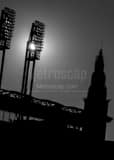 Vertical The Sun Shining Through the Lights at Jacobs Field. landscape black and white Photography