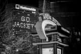 Horizontal Go Jackets and an Arena District Sign Framed Photos