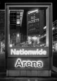 Vertical Go Jackets in the Nationwide Building through the Nationwide Arena Sign black and white Photos