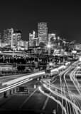 Vertical The Denver Skyline at Night above Colfax Avenue Framed Photos