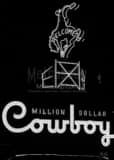 Vertical The Million Dollar Cowboy Bar Sign black and white Photos