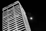 Horizontal The Riverplace Building and Full Moon black and white Photos