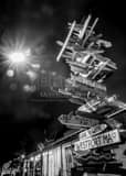 Vertical Mileage Sign Post at Night Photography