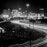 Square The Las Vegas Skyline over Interstate 15 at Night Framed Photos