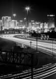 Vertical The Las Vegas Skyline over Interstate 15 at Night Framed Photos