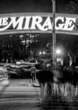 Vertical The Mirage Hotel and Casino at Night Framed Photos