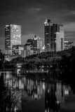 Vertical The Milwaukee Skyline reflecting off of Veterans Pond black and white Photos