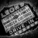 Square Leons Frozen Custard Sign in Puddle black and white Photos