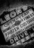 Vertical Leons Frozen Custard Sign in Puddle black and white Photos