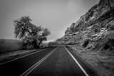 Horizontal Route 163 along the Montezuma Creek black and white Pictures