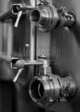 Vertical Wine Tank Valves black and white Photos