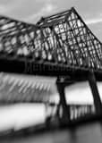 Vertical An Out of Focus shot of the Mississippi River Bridges Framed Photos