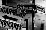 Horizontal Bourbon Street and Orleans Street Signs black and white Photos
