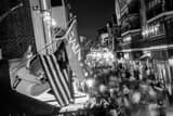 Horizontal Saints Flag Hang above Bourbon Street Framed Photos