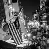 Square Saints Flag Hang above Bourbon Street Framed Photos