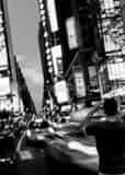 Vertical A Photographer Trying to Capture Times Square Framed Photos