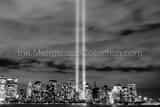 Horizontal The Beams of Light from Lower Manhattan Bounce off of the Low Clouds Framed Photos