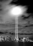 Vertical The Beams of Light from Lower Manhattan Bounce off of the Low Clouds Framed Photos