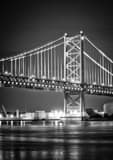 Vertical Cranes along the Delaware River under the Benjamin Franklin Bridge black and white Pictures