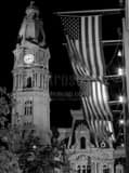 Vertical The Pinnacle of Philadelphia City Hall and US Flags at Night Photography