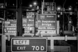 Horizontal Traffic Signs on I-376 in Downtown Pittsburgh at Night black and white Photos