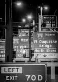 Vertical Traffic Signs on I-376 in Downtown Pittsburgh at Night black and white Photos