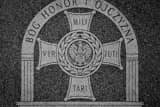 Horizontal Inscription on Memorial in Poland Town Square black and white Pictures