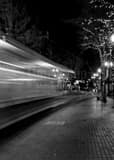 Vertical A Streetcar Streaking Down Yamhill Street black and white Photography
