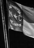 Vertical The North Carolina Flag on the NC Capitol black and white Pictures