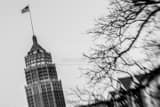Horizontal The American Flag Flies from Tower Life Building Framed Photos