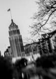 Vertical The American Flag Flies from Tower Life Building Framed Photos