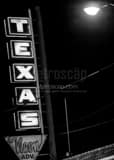 Vertical The Texas Neon Advertising Sign black and white Photos