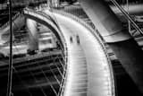 Horizontal Walkers on the Harbor Drive Pedestrian Bridge night time black and white Photography