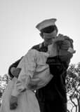 Vertical The Kissing Sailor Sculpture Near the USS Midway Framed Photos