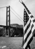 Vertical The Golden Gate Bridge and US Flag black and white Photos