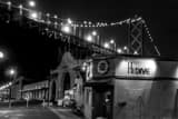 Horizontal The Hi Dive Bar along the Embarcadero under the Bay Bridge black and white Photos