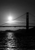 Vertical The Setting Sun Silhouettes the Golden Gate Bridge landscape black and white Photography