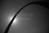 Horizontal The Gateway Arch Silhouetted by the Sun black and white Photos
