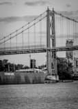 Vertical The Anthony Wayne Bridge and Cleveland-Cliffs Barge on the Maumee black and white Photos