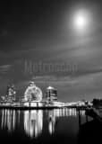 Vertical The Moon Illuminates the TELUS Science World Dome at Night black and white Photos