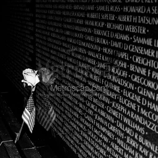 Washington DC Black and White Photos of A Rose and American Flag Leans Against the Vietnam Wall A Rose and American Flag Leans Against the Vietnam Wall -- Washington DC Black and White Photos